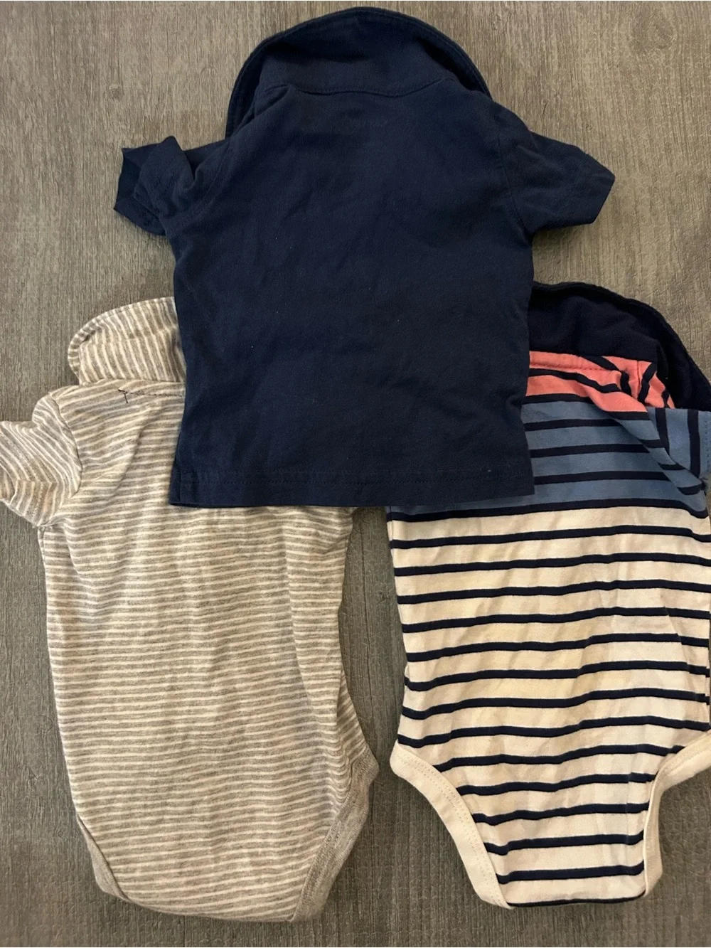 3 New born baby Carter's polo style shirts. (2 are onesies, & 1 is a shirt)